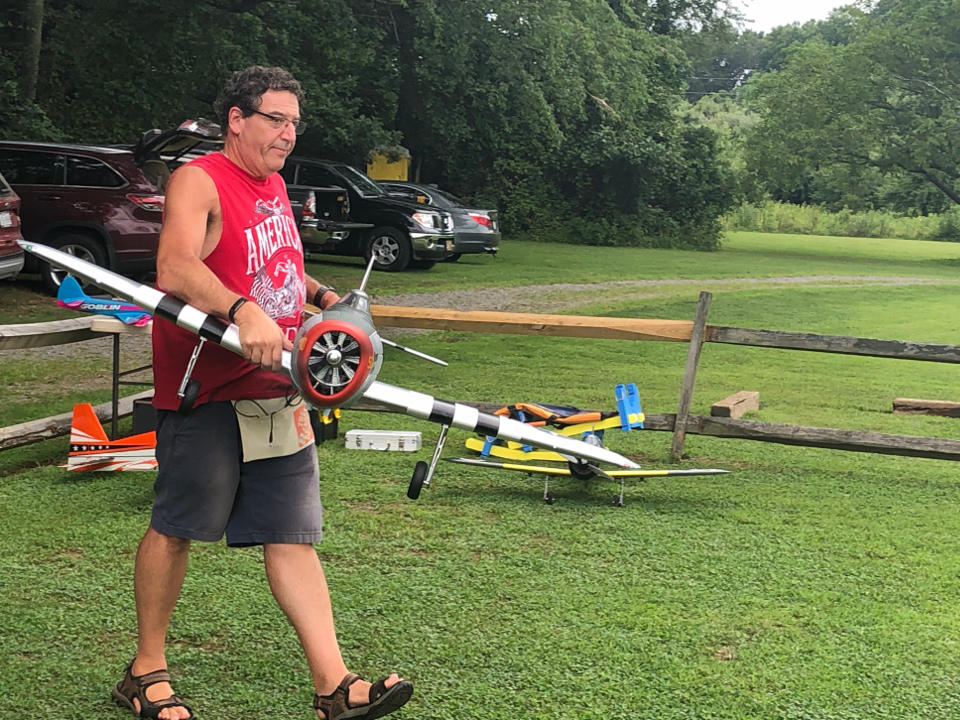 Jeff carrying Jason's plane to flightline