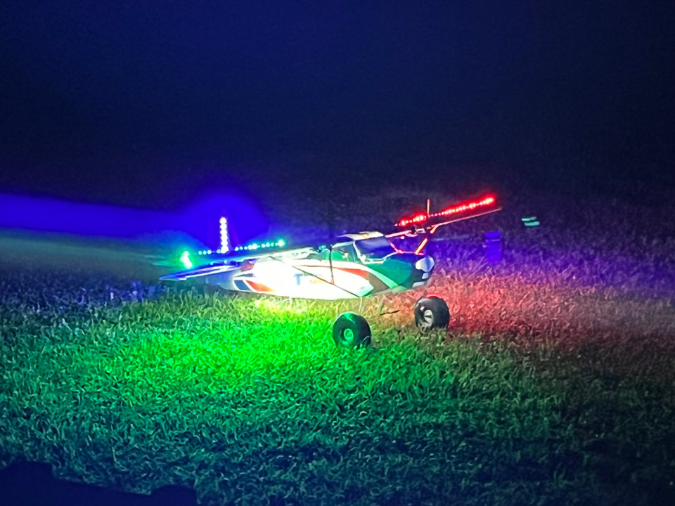 Club members work on a plane